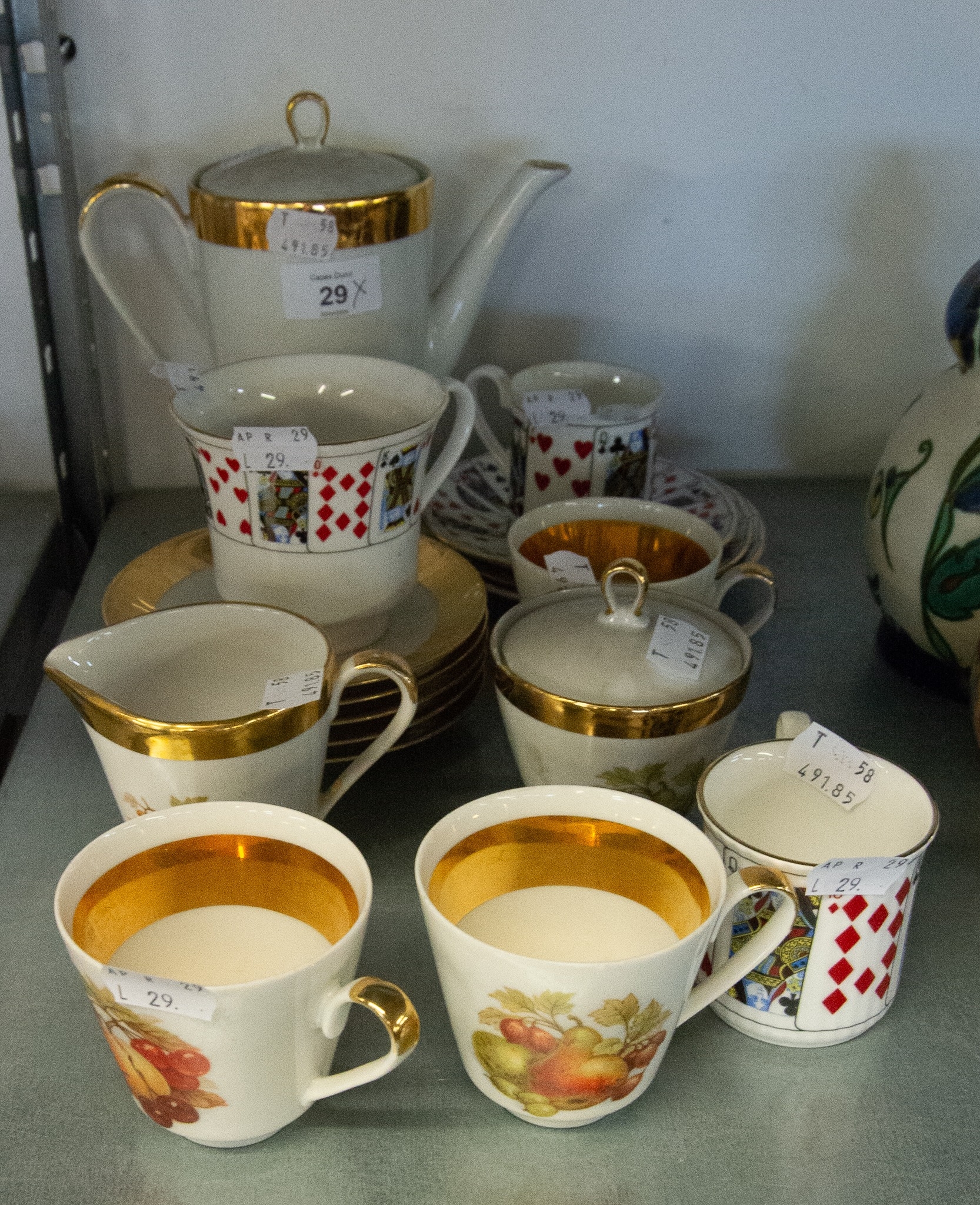 A BAVARIAN CHINA PART COFFEE SET, PRINTED WITH FRUIT AND 'THREE QUEEN'S CHINA 'CUT FOR CARDS'