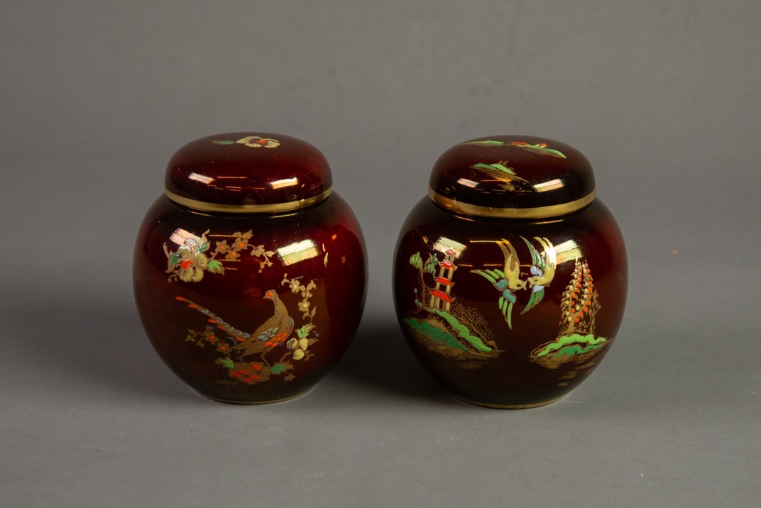 TWO CARLTON WARE ROUGE ROYAL SMALL POTTERY GINGER JARS AND COVERS, one of the MIKADO pattern, the