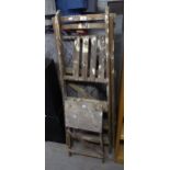 A SET OF VINTAGE WOOD STEP LADDERS AND A SIMILAR SMALLER SET (2)