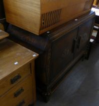 1930’S CARVED OAK SIDEBOARD OF JACOBEAN STYLE, ENCLOSED BY TWO DOORS