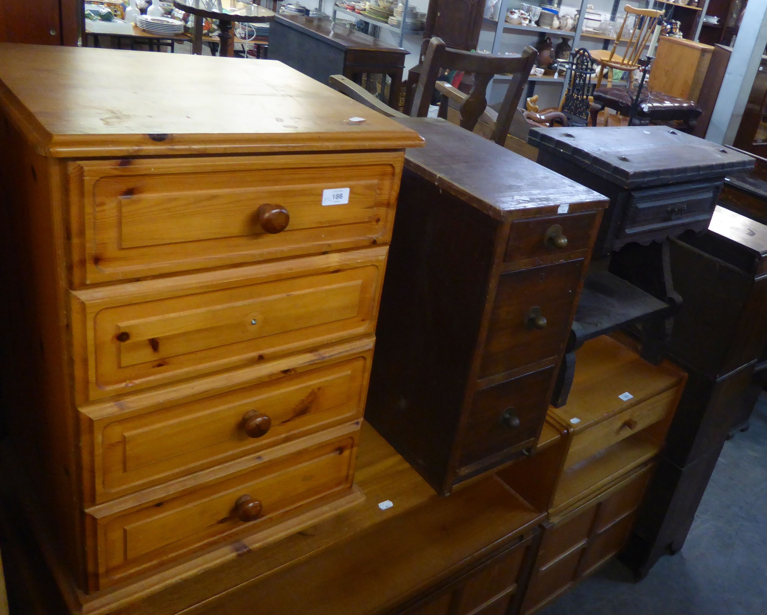 A PINE BEDSIDE FOUR DRAWER CHEST A.F.) AND AN OAK THREE DRAWER PEDESTAL AND AN OAK SIDE TABLE  (3)