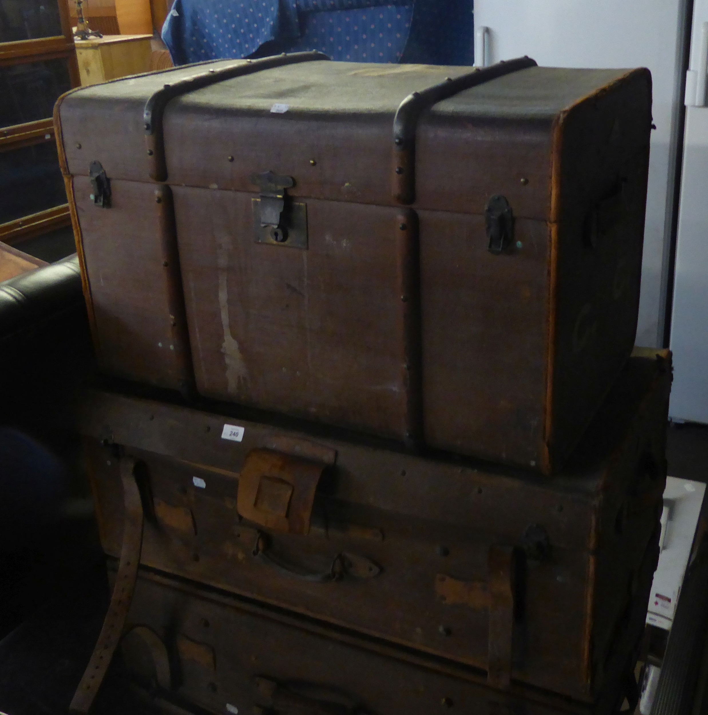 A LARGE CANVAS AND WOOD BOUND CABIN TRUNK AND ANOTHER CANVAS TRUNK WITH LEATHER STRAPS (2)