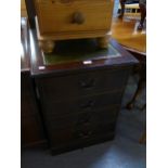 A MAHOGANY REPRODUCTION FOUR DRAWER FILING CABINET WITH GREEN LEATHER AND GILT DECORATED INSET TOP