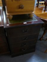 A MAHOGANY REPRODUCTION FOUR DRAWER FILING CABINET WITH GREEN LEATHER AND GILT DECORATED INSET TOP