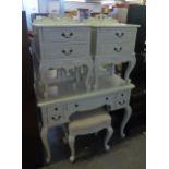 AN ORNATE AND WHITE SUITE OF BEDROOM FURNITURE TO INCLUDE; CHEST OF DRAWERS, TWO OVER THREE