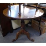 A NINETEENTH CENTURY CIRCULAR SNAP-TOP BREAKFAST TABLE