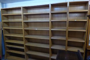 A RANGE OF FIVE 7' 2 1/2" OAK 6 SHELF OPEN BOOKCASES, COMPRISING OF TWO 3'4" BOOKCASES AND THREE 1'