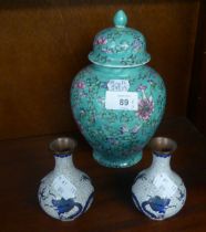 CHINESE ENAMELLED PORCELAIN GINGER JAR AND COVER, DECORATED WITH FLOWERS AND FOLIATE SCROLLS, ON A