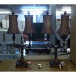 PAIR OF BLACK AND GILT METAL AND GLASS ELECTRIC TWO LIGHT CANDELABRA, AS BEDSIDE LAMPS WITH SHADES