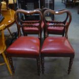 A SET OF FOUR MAHOGANY VICTORIAN BALLOON BACK DINING CHAIRS, WITH RED VINYL SEATS (4)