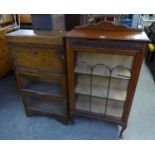 A SMALL GLAZED OAK SINGLE DOOR BOOKCASE, AND AN OAK THREE TIER MINTY STYLE BOOKCASE, AND A TWO