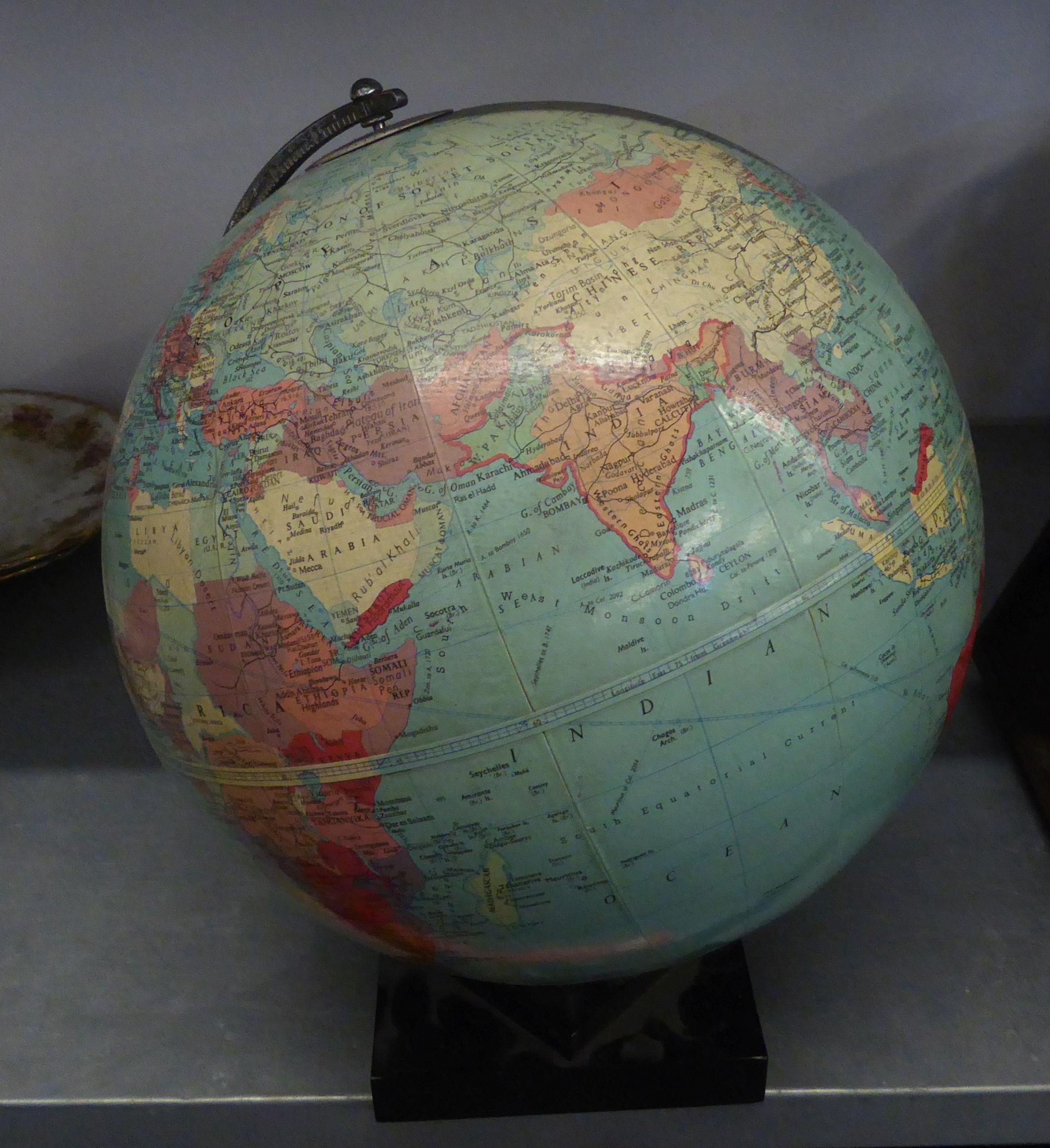 A TERRESTRIAL GLOBE ON STAND