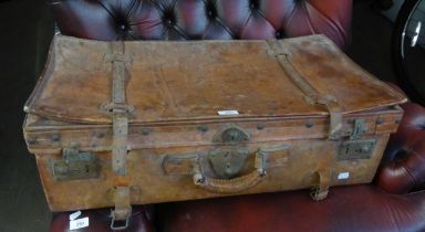 A LARGE VINTAGE LEATHER SUITCASE