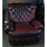 THOMAS LLOYD OBLONG LOUNGE CHAIR BUTTON UPHOLSTERED IN DARK CRIMSON HIDE WITH RECLINING ACTION AND