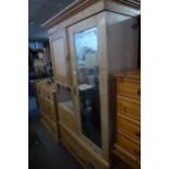 A VICTORIAN PINE DOUBLE WARDROBE, WITH SINGLE MIRROR DOOR (MIRROR A.F.) AND A SINGLE PANEL DOOR WITH