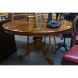 A CIRCULAR MAHOGANY BREAKFAST TABLE WITH TILT-TOP ON TRIPOD BASE