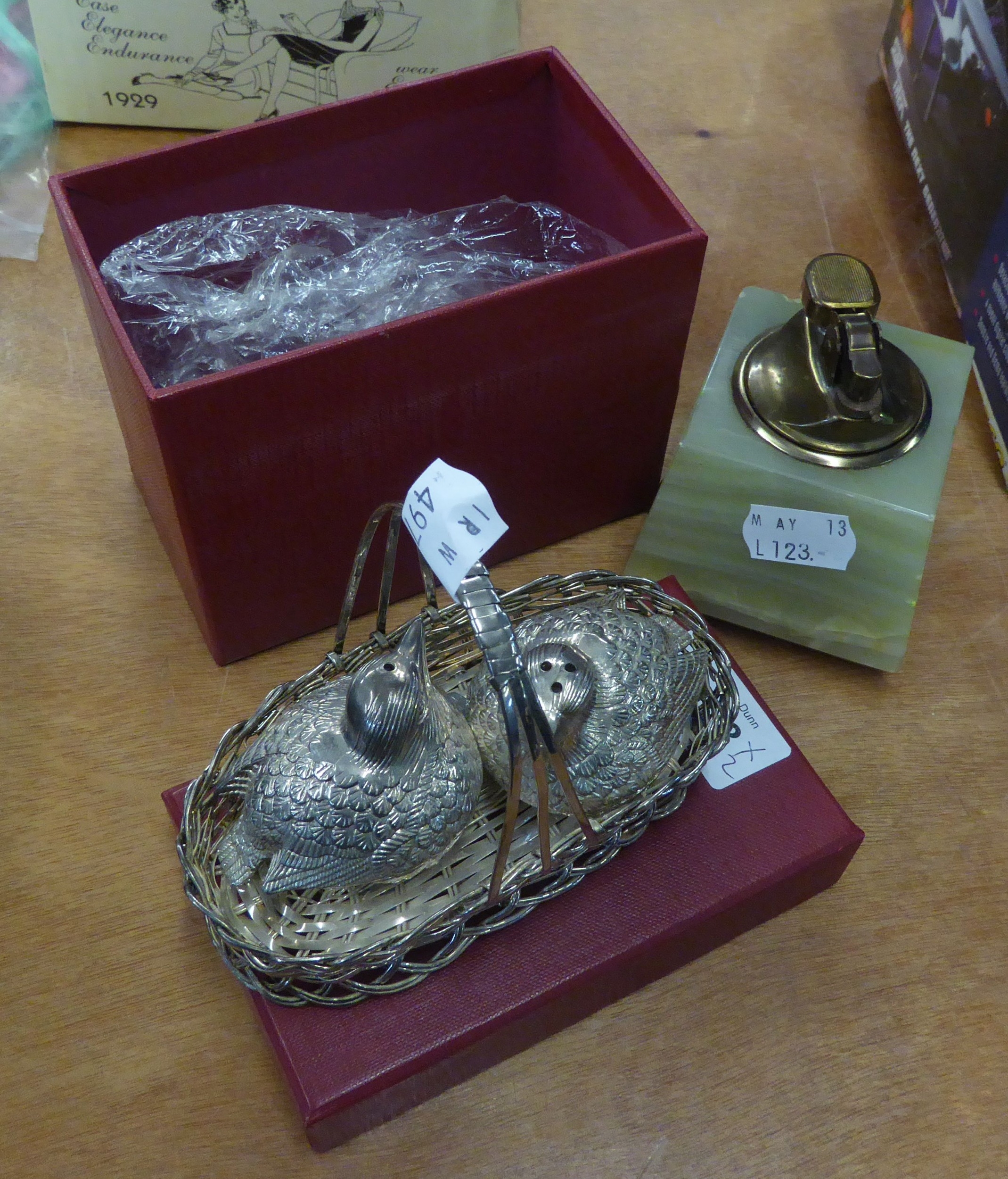 AN ELECTROPLATE H. SAMUELS CRUET FRAME IN THE FORM OF TWO CHICKENS IN A BASKET AND AN ONYX TABLE