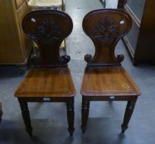 A PAIR OF VICTORIAN MAHOGANY SHIELD BACK HALL CHAIRS (2)