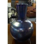 A BLUE LUSTRE GLAZED BALL AND SHAFT SHAPED VASE