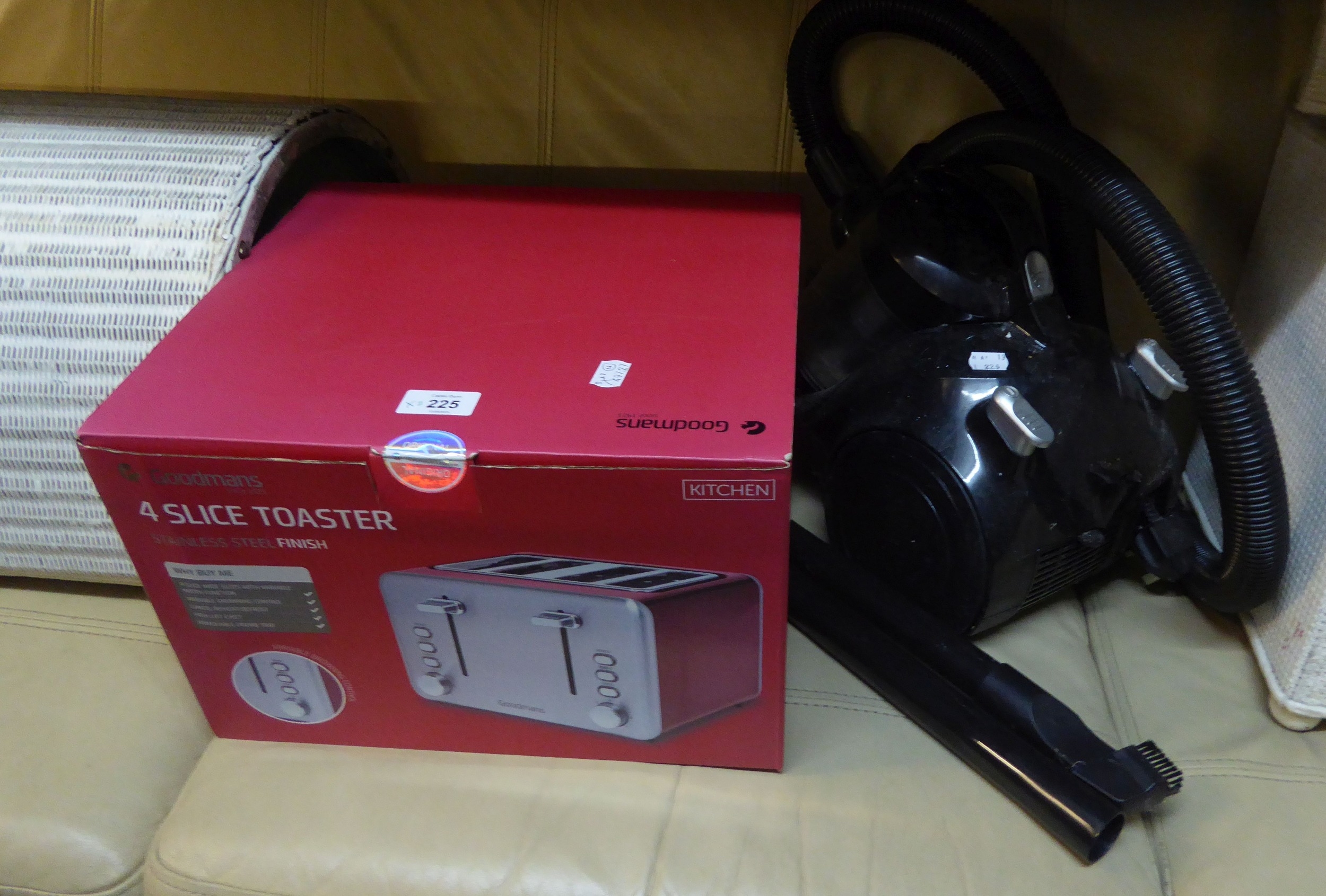 A VAX VACUUM CLEANER AND A GOODMAN'S FOUR SLICE TOASTER (NEW, BOXED)