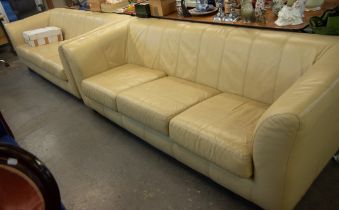 PAIR OF CREAM LEATHER THREE SEATER SOFAS (2)