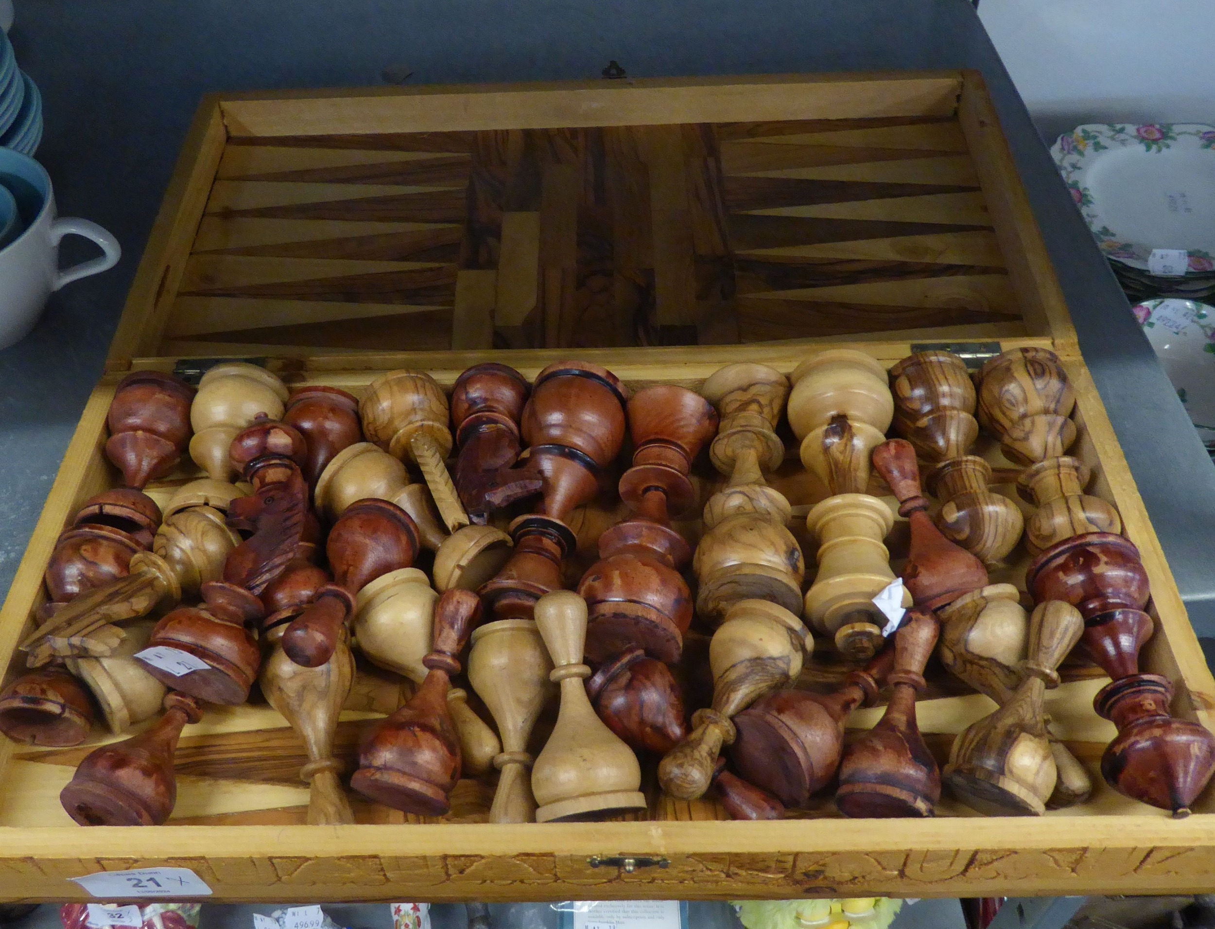 AN OLIVE WOOD SET OF LARGE CHESS PIECES, IN OLIVE WOOD BOX OPENING TO FORM THE CHESSBOARD