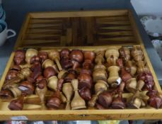 AN OLIVE WOOD SET OF LARGE CHESS PIECES, IN OLIVE WOOD BOX OPENING TO FORM THE CHESSBOARD