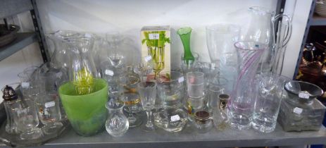 A LARGE SELECTION OF MOULDED GLASS WARES TO INCLUDE; LARGE VASES, VARIOUS GLASSES, GLASS CAT