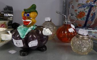 AN ITALIAN COLOURED GLASS CLOWN WITH SHAPED BODY AND THREE VARIOUS PERFUME BOTTLES