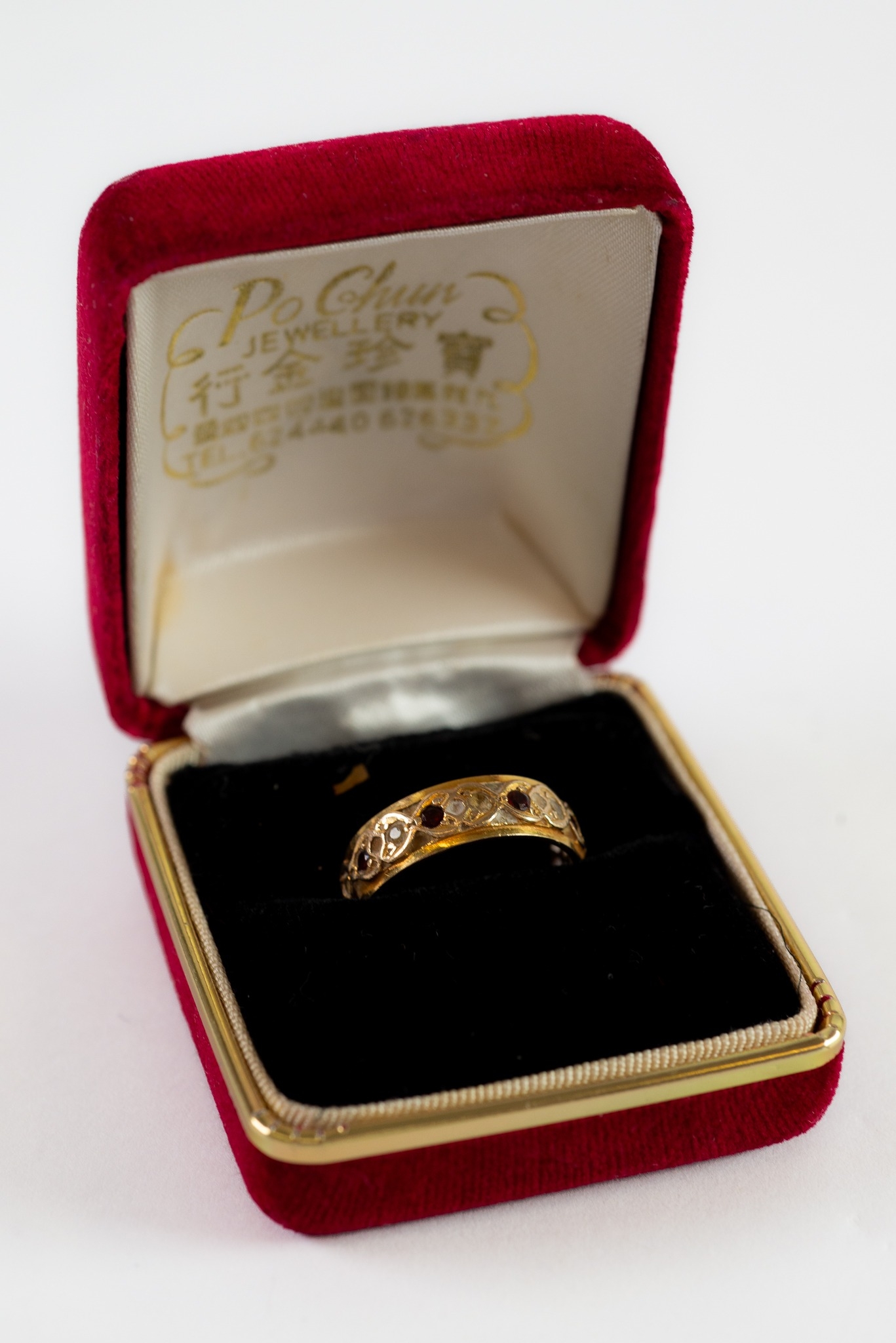 9ct GOLD TINY GARNET AND WHITE STONE SET ETERNITY RING, together with an unmarked YELLOW and WHITE - Image 2 of 4
