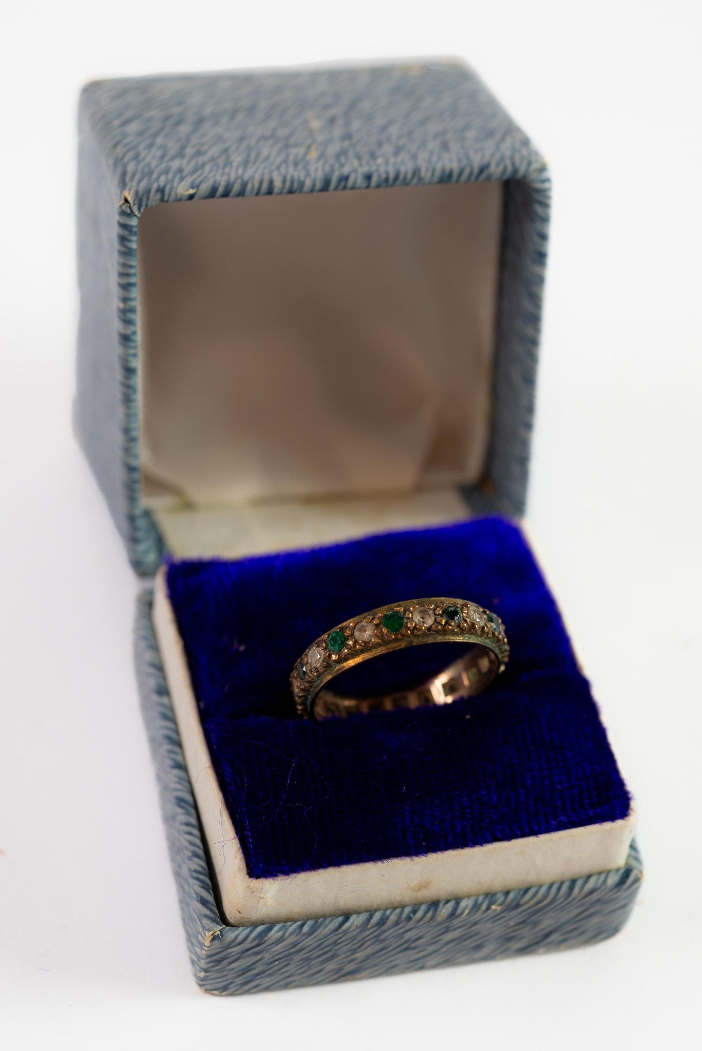 9ct GOLD TINY GREEN AND WHITE STONE SET ETERNITY RING, another unmarked GOLD COLOUR METAL TINY WHITE