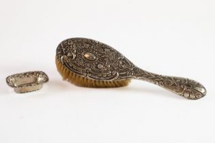 LATE VICTORIN EMBOSSED SILVER CLAD DRESSING TABLE HAIR BRUSH, decorated with cherubs, scrolls and