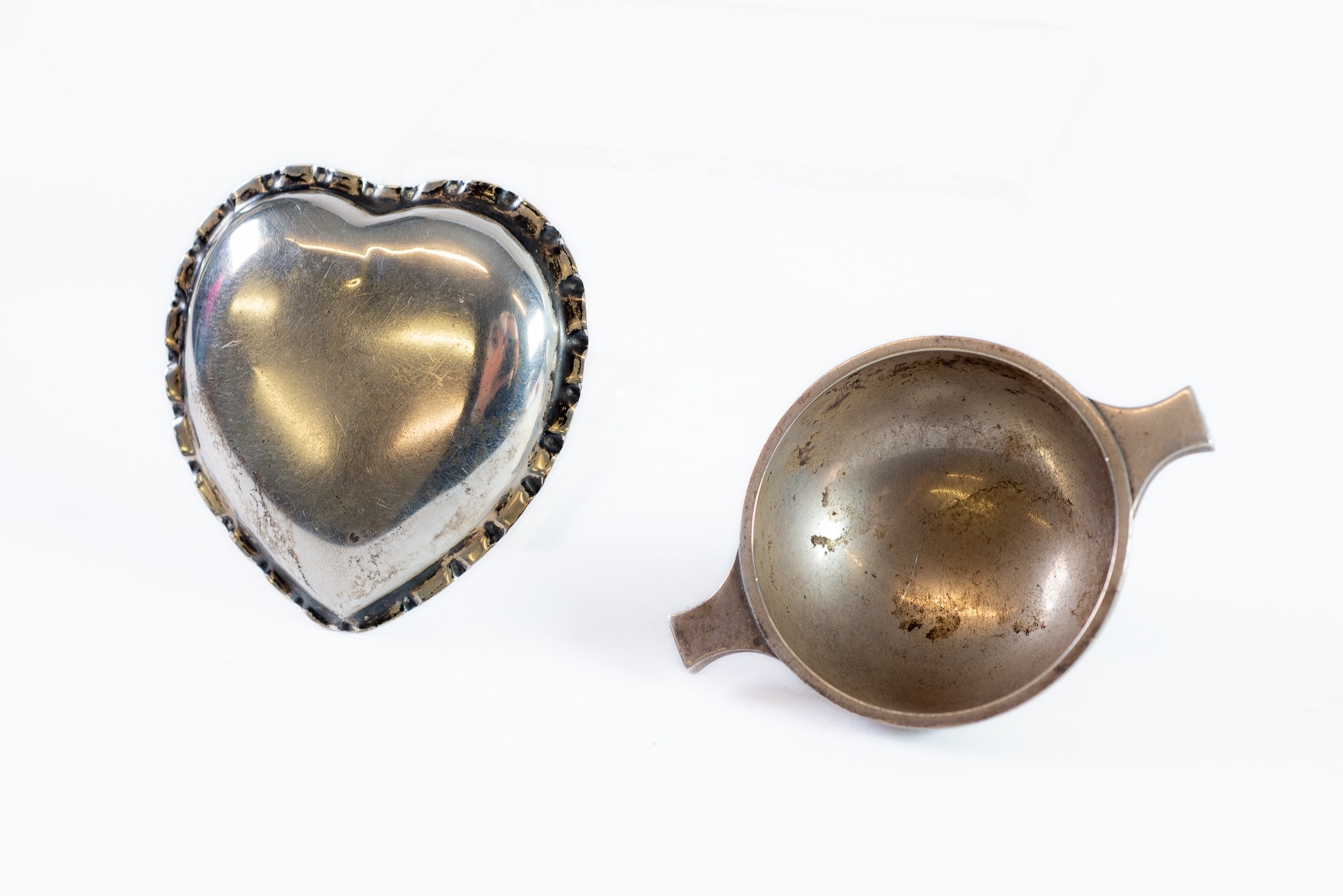 TWO SMALL SILVER DISHES, one of quaich form, Edinburgh 1959, the other of heart form, Birmingham