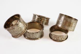 FIVE EDWARD VII AND LATER SILVER NAPKIN RINGS, including an ivy leaf engraved pair, 2.30ozt, (5)