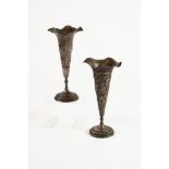 NEAR PAIR OF ANGLO INDIAN WEIGHTED AND EMBOSSED ELECTROPLATED TRUMPET VASES, each of typical form