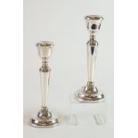 PAIR OF WEIGHTED SILVER CANDLESTICKS, each of tapering form with beaded border and circular base,