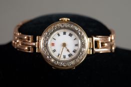 LADY'S 18ct GOLD WRIST WATCH with mechanical movements, white porcelain white roman dial, the