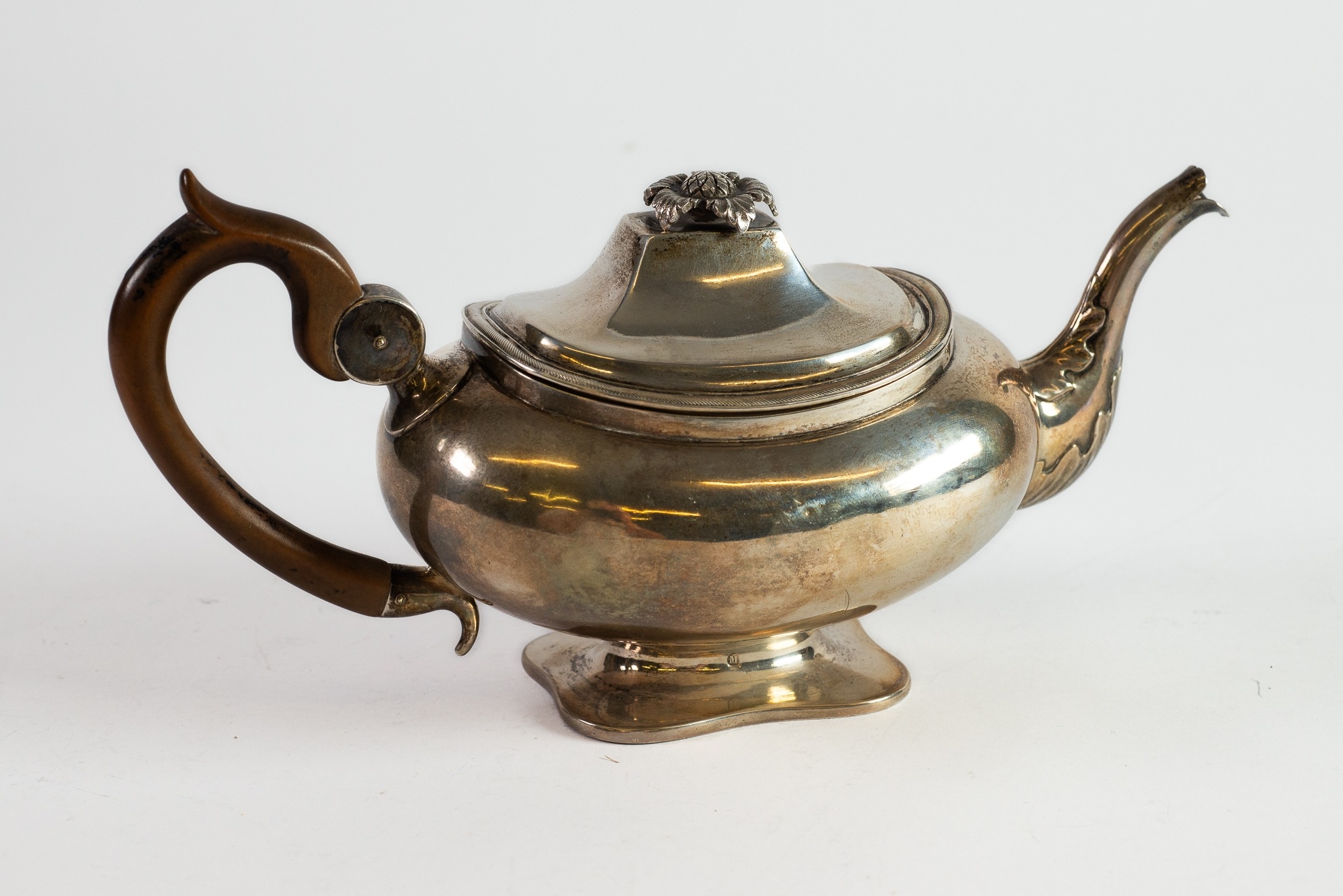 NETHERLANDS SILVER COLOURED METAL (833 standard) TEAPOT, of rounded oblong, footed form with brown