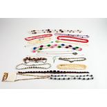 EIGHTEEN ASSORTED SIMULATED PEARL, SIMULATED CORAL AND OTHER COSTUME NECKLACES (18)