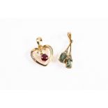 9ct GOLD OPEN HEART PENDANT with floating ruby to the centre and diamond accents to heart; 9ct