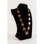 NECKLACE WITH FIFTEEN BRITISH, AMERICAN AND WORLD COINS, graduated in size with chain links