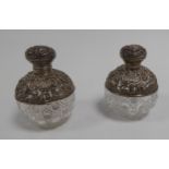 EDWARD VII PAIR OF SILVER MOUNTED CUT GLASS SCENT BOTTLES, each of orbicular form with hinged