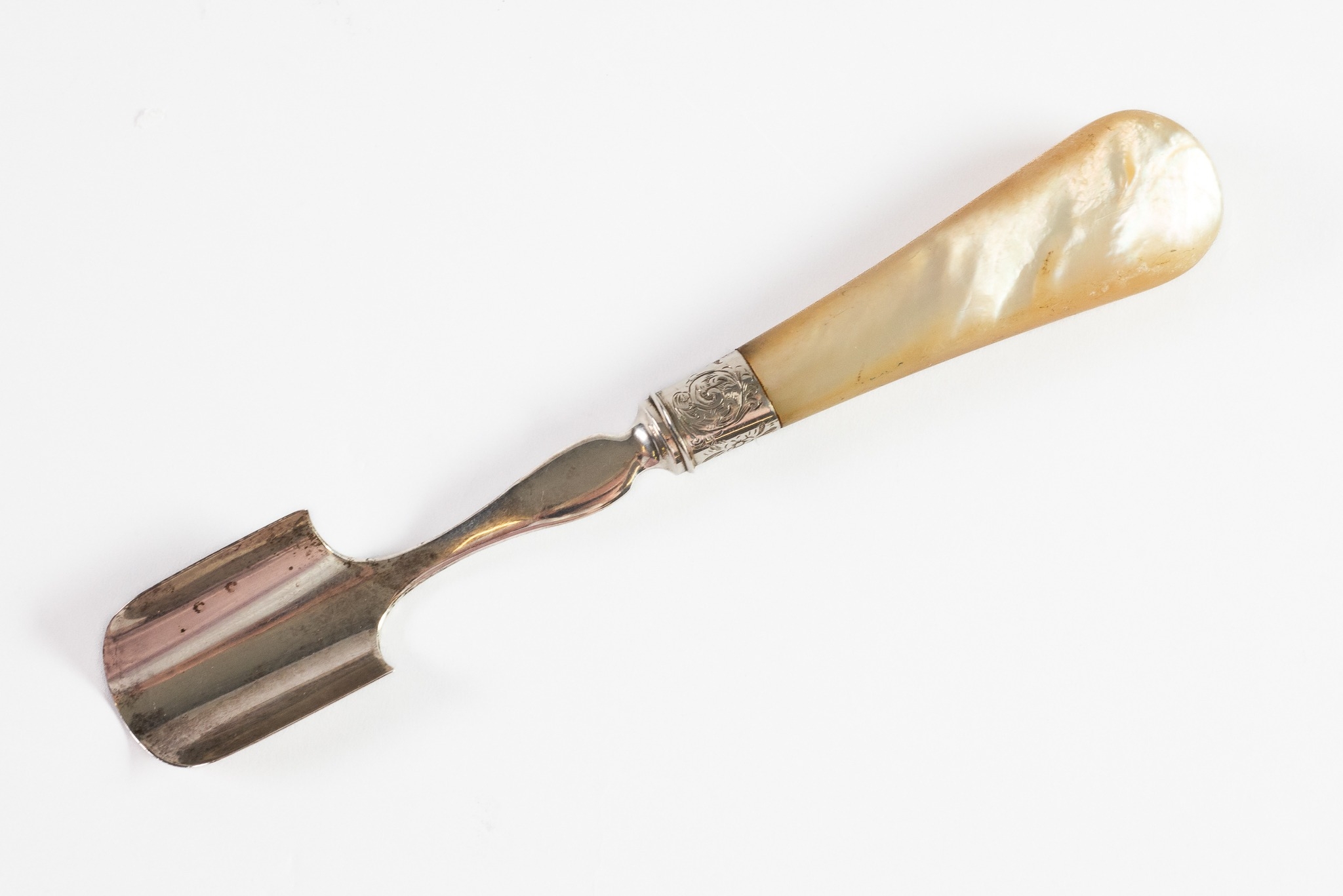 NINETEENTH CENTURY SILVER STILTON SCOOP WITH MOTHER OF PEARL HANDLE, of typical form with engraved