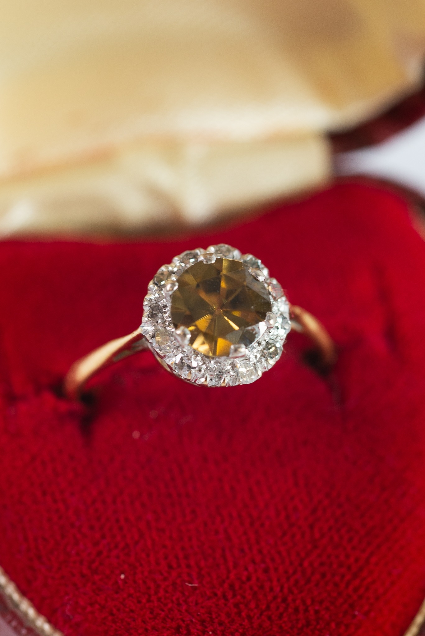 GOLD COLOUR METAL (no carat mark) YELLOW/GREEN STONE SET RING, within a border of TINY DIAMONDS, 2.8 - Image 2 of 2