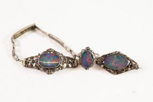 SILVER AND COLLET SET OVAL OPAL DOUBLET JEWELLERY with floral and foliate surrounds, viz a bracelet,
