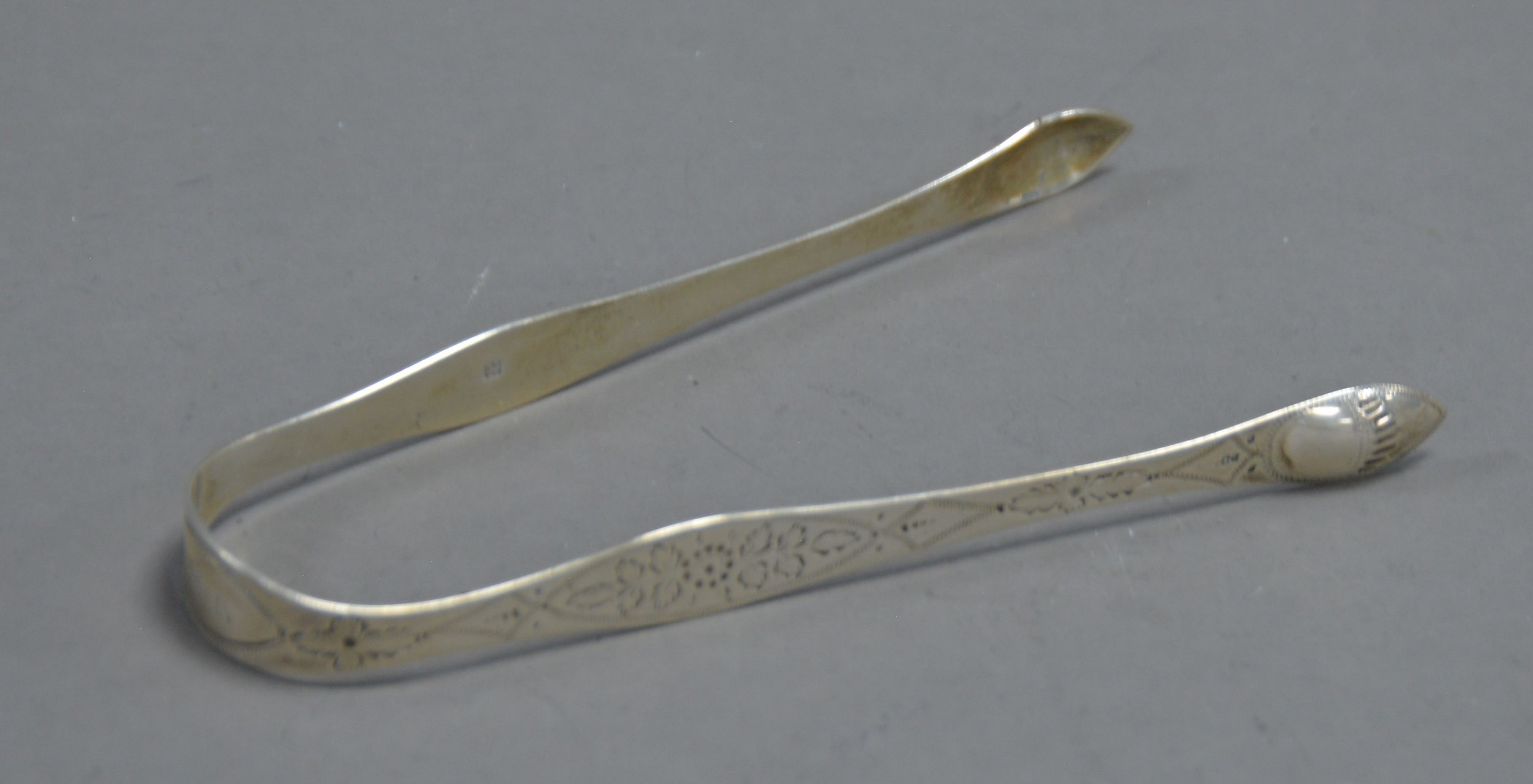 PAIR OF GEORGE III BRIGHT CUT SILVER SUGAR TONGS BY PETER AND ANN BATEMAN, initialled, 5 ½” (14cm) - Image 6 of 6