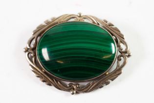 LARGE SILVER FRAME CABOCHON OVAL MALACHITE BROOCH, with foliated scroll surround, 2 1/4in (5.5cm)