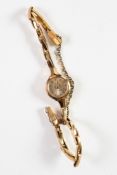 LADY'S ROTARY 9ct GOLD WRISTWATCH, with mechanical movement, small silvered dial with batons and the