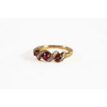 9ct GOLD, RUBY AND DIAMOND RING with spiral setting of 18 tiny diamonds and 3 oval rubies, 3.8gms,