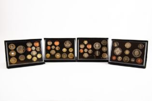 FOUR ROYAL MINT DELUXE UNITED KINGDOM PROOF COIN SETS, for years 2008, 2009, 2010 and 2011, each